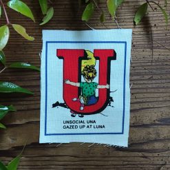 Sew on Patch - Quirky Alphabet - The Letter U - Unsocial Una gazed up at Luna